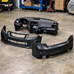 Close-up of an injection molded automotive plastic part with smooth surface finish, demonstrating high-quality, defect-free production