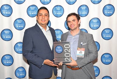 Lenny Gutierrez, left, and Tom Hanvey of Asaclean-Sun Plastech Inc. accept the Best Places to Work award Feb. 26 in Naples, Fla., at the Plastics News Executive Forum.