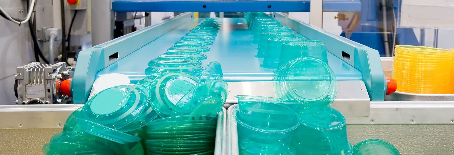 Plastic food storage containers coming off an assembly line