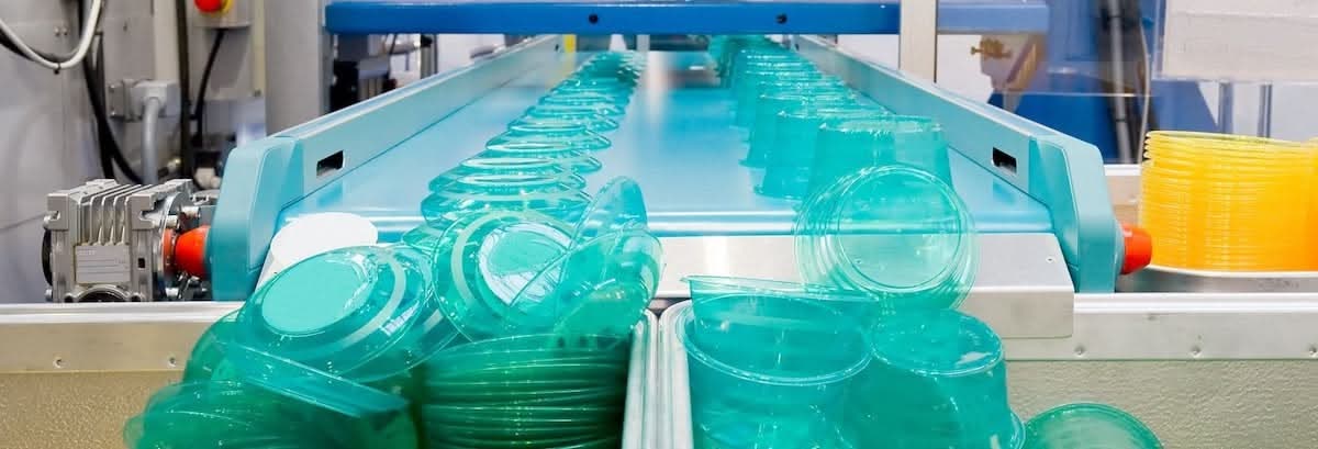 Plastic food storage containers coming off an assembly line